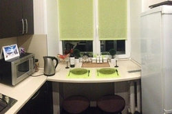 Photo of a kitchen in Khrushchev with a window sill table