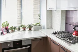 If the countertop is higher than the window sill in the kitchen photo