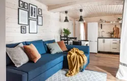 Kitchen and living room at the dacha in a wooden house photo