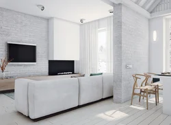 Дизайн гостиной с белой кирпичной стеной