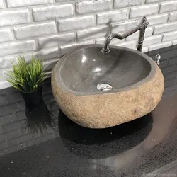 Bathroom sinks made of stone photo