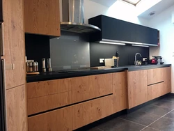 Dark kitchen with wood photo