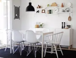 Shelves above the table in the kitchen interior photo