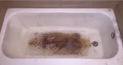 Photo of a rusty bathtub