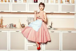 Photo Of A Housewife In The Kitchen