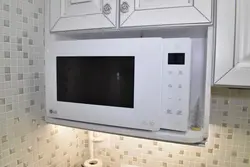 Microwave downstairs in the kitchen photo
