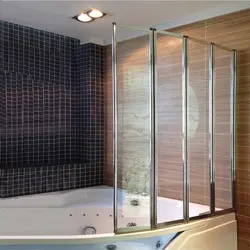 Bathtub with plastic curtains photo
