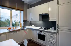 Photo of a kitchen with a window on the right