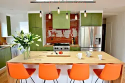 Orange chairs in the kitchen photo