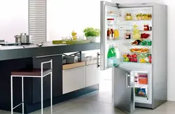 Open refrigerator in the kitchen photo