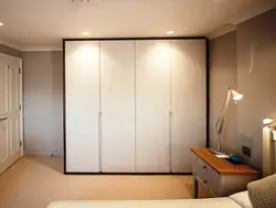 Tall wardrobe in the bedroom photo