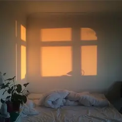 Photo of a bedroom at night with a window
