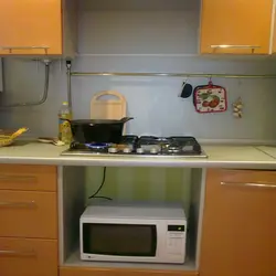 Black microwave in the kitchen photo