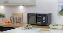 Black microwave in the kitchen photo