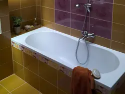 Photo of a bathtub with a tap in the middle