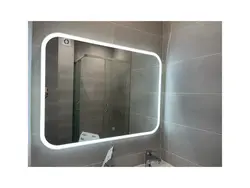 Mirror next to the bathroom photo