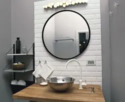 Mirror next to the bathroom photo