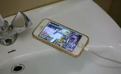 Photo with phone in bathroom