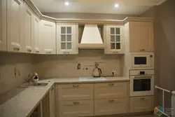 Photo Of A Beige Kitchen With A Hood