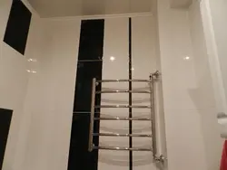 Photo of a heated towel rail in a small bathroom