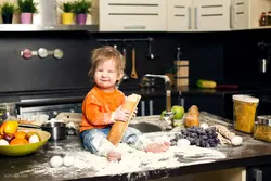 Little girl in the kitchen photo