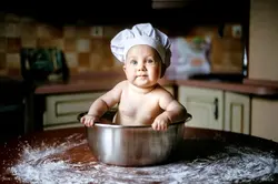 Little girl in the kitchen photo