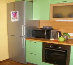 Cabinet above the refrigerator in the kitchen photo