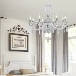 White chandelier in the living room interior photo