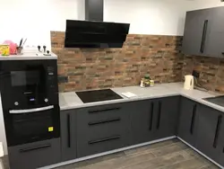 Gray kitchen with black handles photo