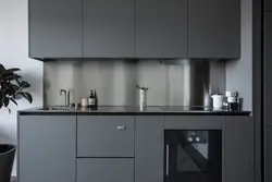 Gray kitchen with black handles photo