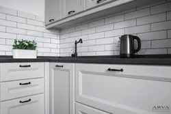 Gray kitchen with black handles photo