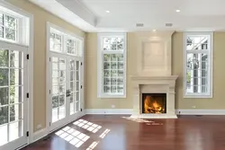 Fireplace between the windows in the living room photo