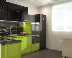 Green kitchen with black countertop photo