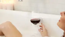 In the bath with a glass of wine photo