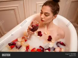 In the bath with a glass of wine photo
