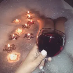 Bath with foam and wine photo
