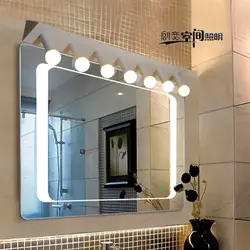 Bathroom mirror with sconce photo