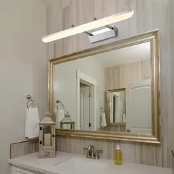 Bathroom mirror with sconce photo