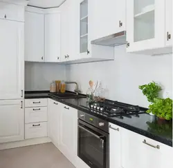 White Kitchen With Black Apron Photo