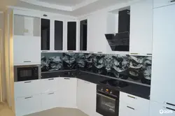 White Kitchen With Black Apron Photo