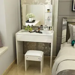 Table with cabinet in the bedroom photo