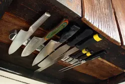 Magnet for knives photo in the kitchen