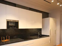 Black Appliances In A Beige Kitchen Photo