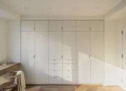 Built-in wardrobe in the living room photo