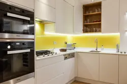 White kitchen with yellow apron photo