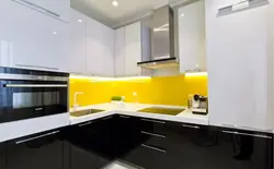 White Kitchen With Yellow Apron Photo