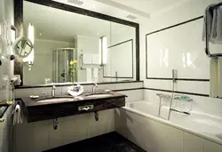 Photo of a mirror above the bathroom sink