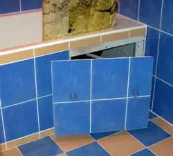 Hatch under the bathtub under the tiles photo