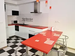 Photo of a kitchen with a red countertop photo