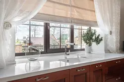 Curtains in the kitchen above the countertop photo